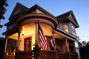 Man on Porch of Home on Dayton Lane for a Ghost Walk Tour 