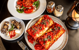 image of Rossville Pizza spread, Including caprese salad, Pizza, and cannolis