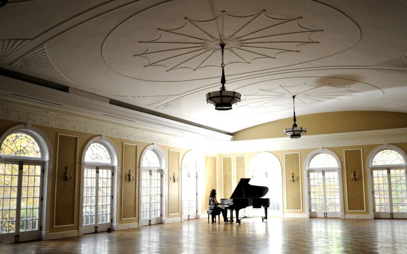 A piano in the ballroom at the Oxford Community Arts Center
