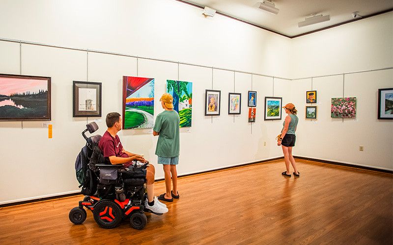 A family explores an art exhibit at the Middletown Arts Center