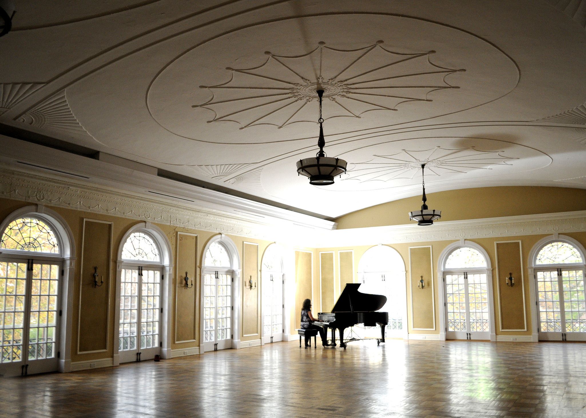 A piano in the ballroom at the Oxford Community Arts Center